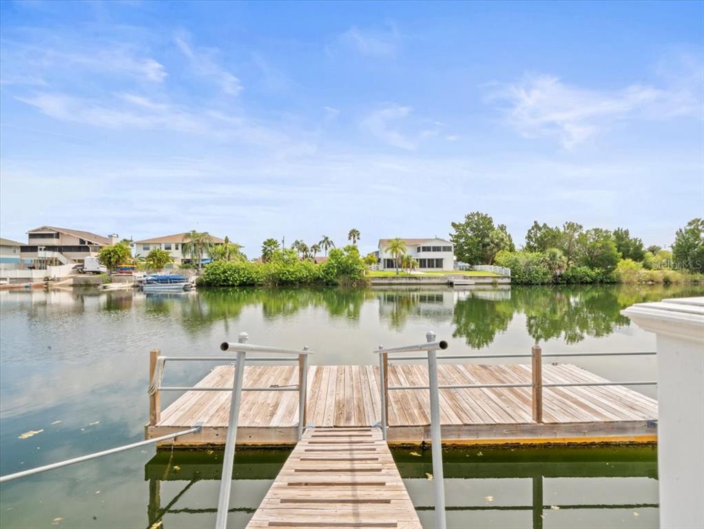 3408 Crape Myrtle Drive Hernando Beach, FL 34607 - Photo 32 of 46 a view of a lake with a outdoor space
