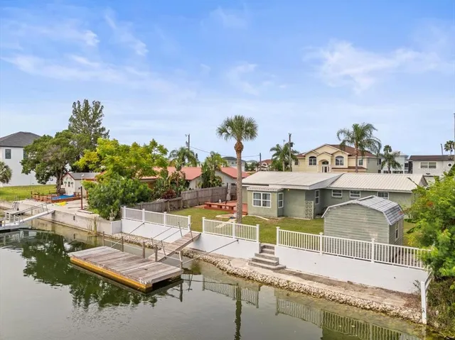 a view of a swimming pool with outdoor seating