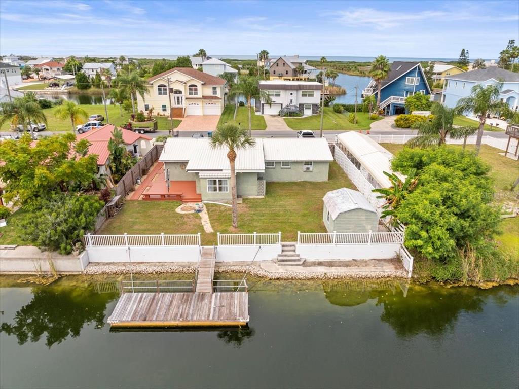 3408 Crape Myrtle Drive Hernando Beach, FL 34607 - Photo 38 of 46 an aerial view of residential houses with outdoor space and swimming pool