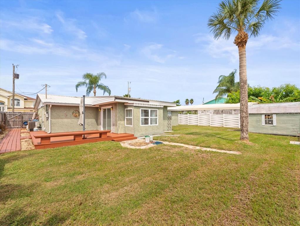 3408 Crape Myrtle Drive Hernando Beach, FL 34607 - Photo 4 of 46 a front view of house with yard swimming pool and seating