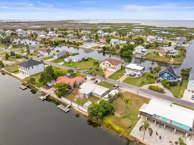 an aerial view of residential houses with outdoor space