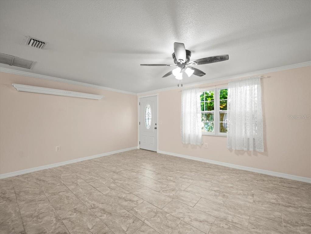 3408 Crape Myrtle Drive Hernando Beach, FL 34607 - Photo 7 of 46 a view of an empty room with a window