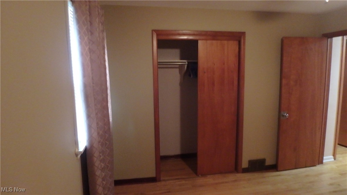 2901 Dentzler Road Parma, OH 44134 - Photo 14 of 25 Unfurnished bedroom featuring light wood finished floors and a closet