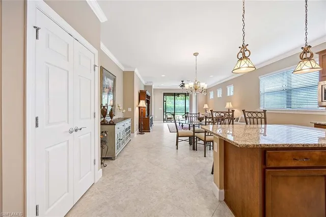 a very nice looking dining room with a large window
