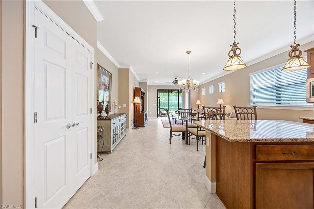 7638 Jacaranda Lane Naples, FL 34114 - Photo 11 of 50 a very nice looking dining room with a large window