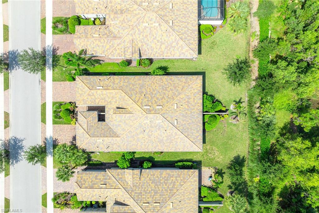 7638 Jacaranda Lane Naples, FL 34114 - Photo 30 of 50 an aerial view of a house with a yard and garden