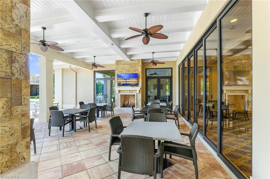 7638 Jacaranda Lane Naples, FL 34114 - Photo 34 of 50 a view of a dining room with furniture window and outside view