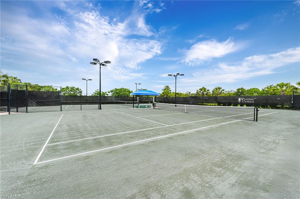 7638 Jacaranda Lane Naples, FL 34114 - Photo 43 of 50 a view of a tennis court
