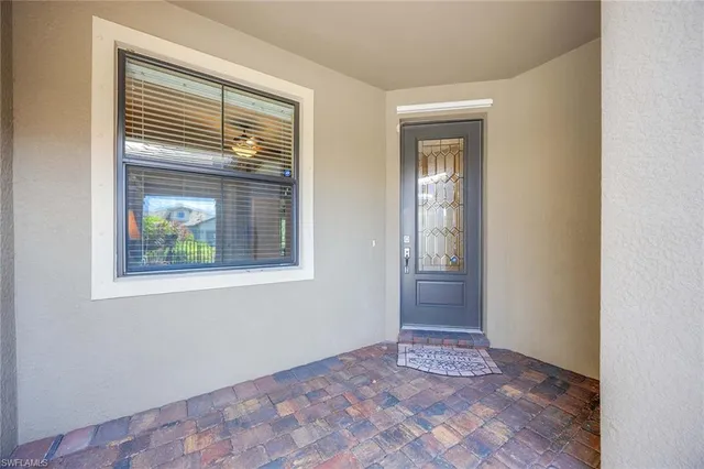 a view of an empty room and window