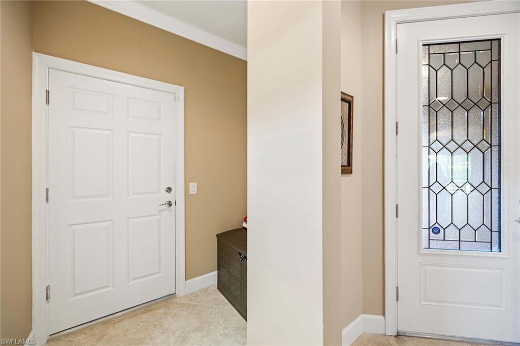 7638 Jacaranda Lane Naples, FL 34114 - Photo 9 of 50 a view of a hallway with entryway door