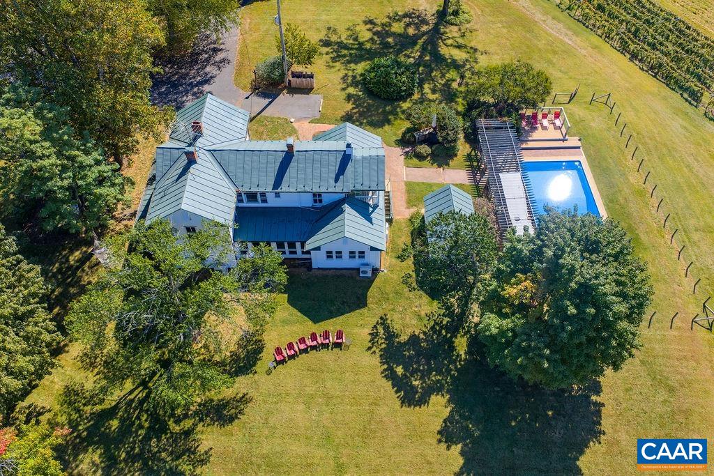 9175 Batesville Road Afton, VA 22920 - Photo 16 of 74 an aerial view of a house with swimming pool and large trees