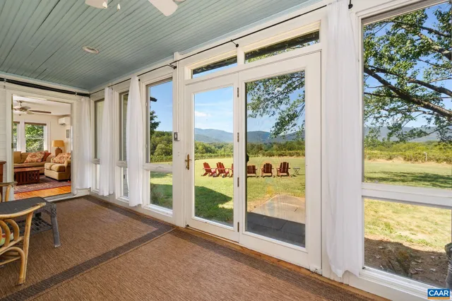 a view of balcony with wooden floor and fence