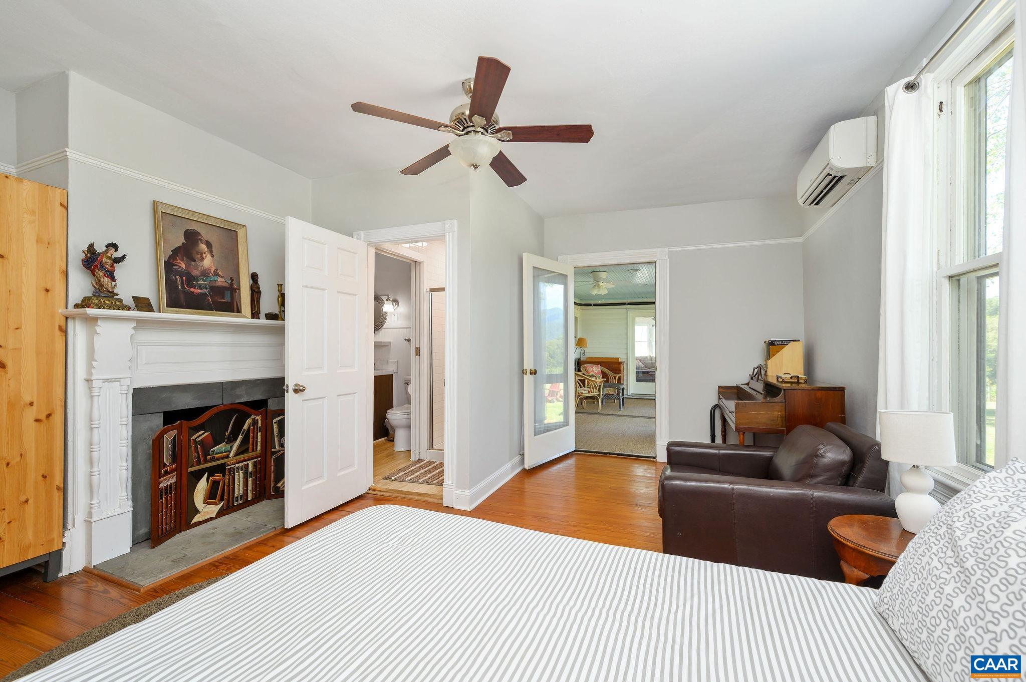 9175 Batesville Road Afton, VA 22920 - Photo 26 of 74 a bedroom with a bed and a chandelier