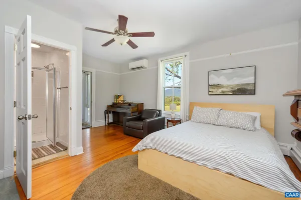 a living room with a book shelf and a book shelf