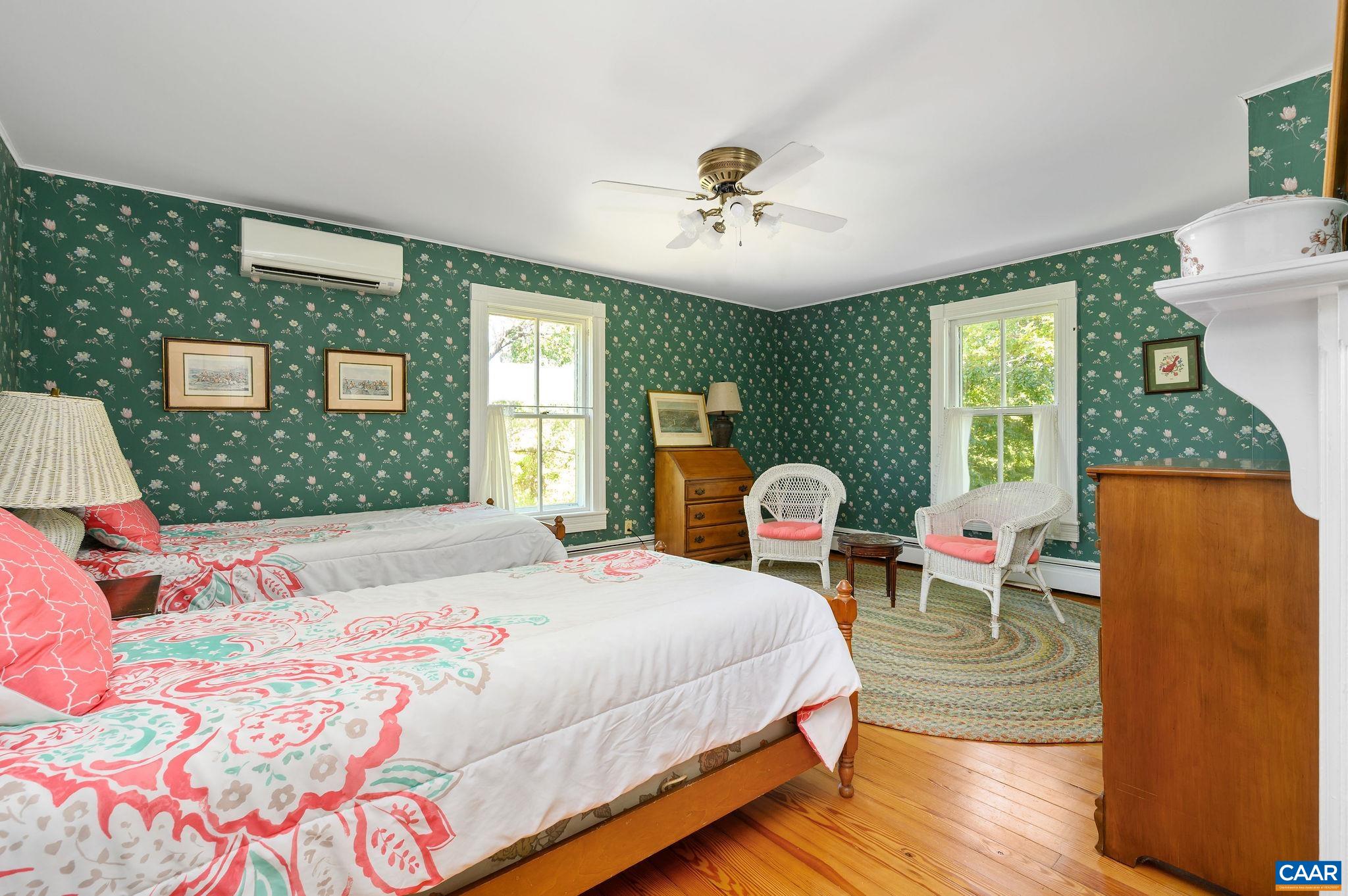9175 Batesville Road Afton, VA 22920 - Photo 32 of 74 a bedroom with a bed wooden floor and window