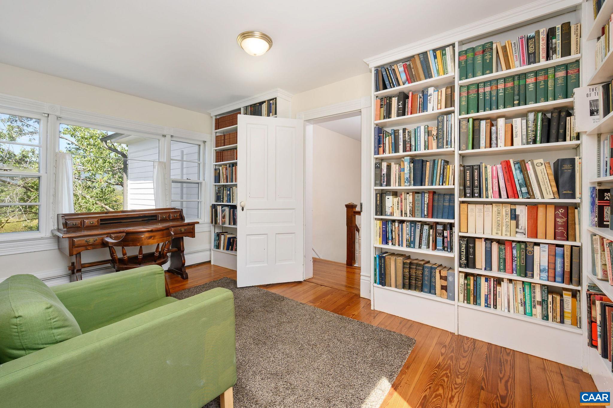 9175 Batesville Road Afton, VA 22920 - Photo 38 of 74 a living room with a book shelf and a book shelf