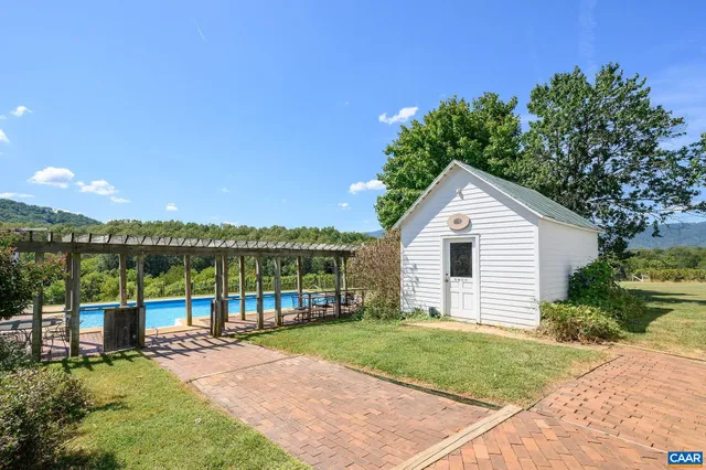 a view of a lake in middle of the forest