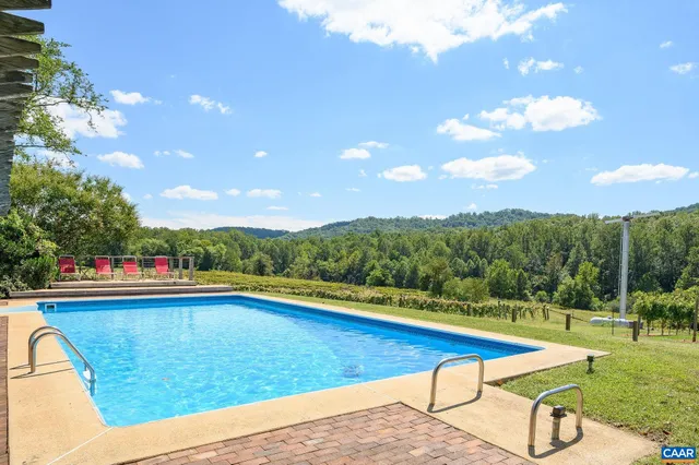 a view of a house with a yard and a large window