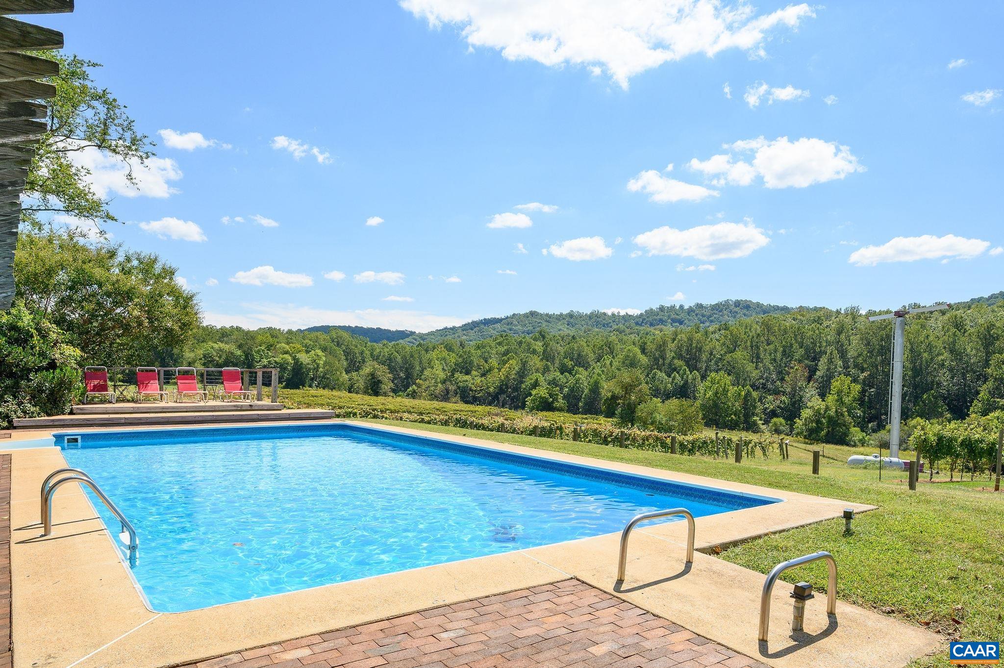 9175 Batesville Road Afton, VA 22920 - Photo 42 of 74 a view of swimming pool with a garden and deck