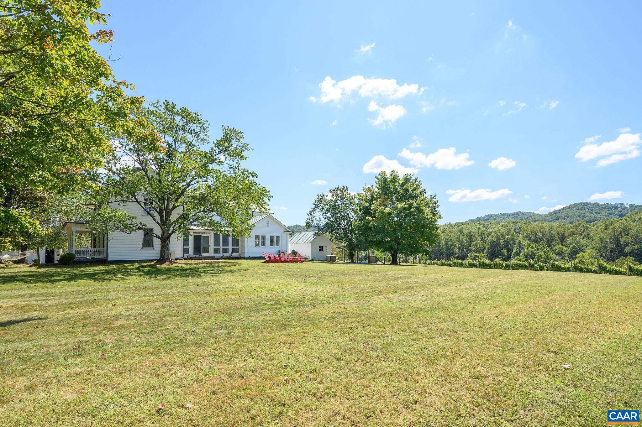 9175 Batesville Road Afton, VA 22920 - Photo 45 of 74 a view of a green field with trees in the background