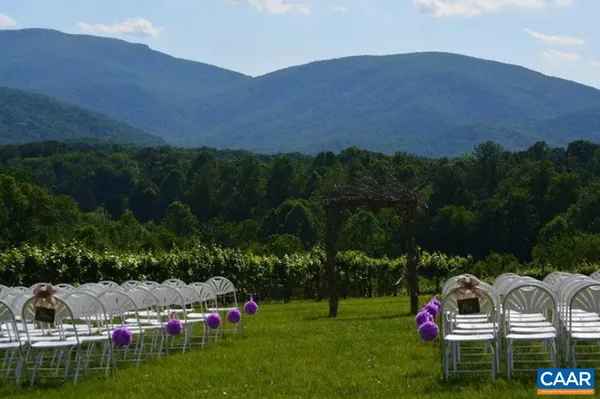 a view of a swimming pool with mountains in the background