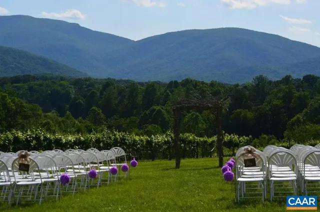 a view of a swimming pool with mountains in the background