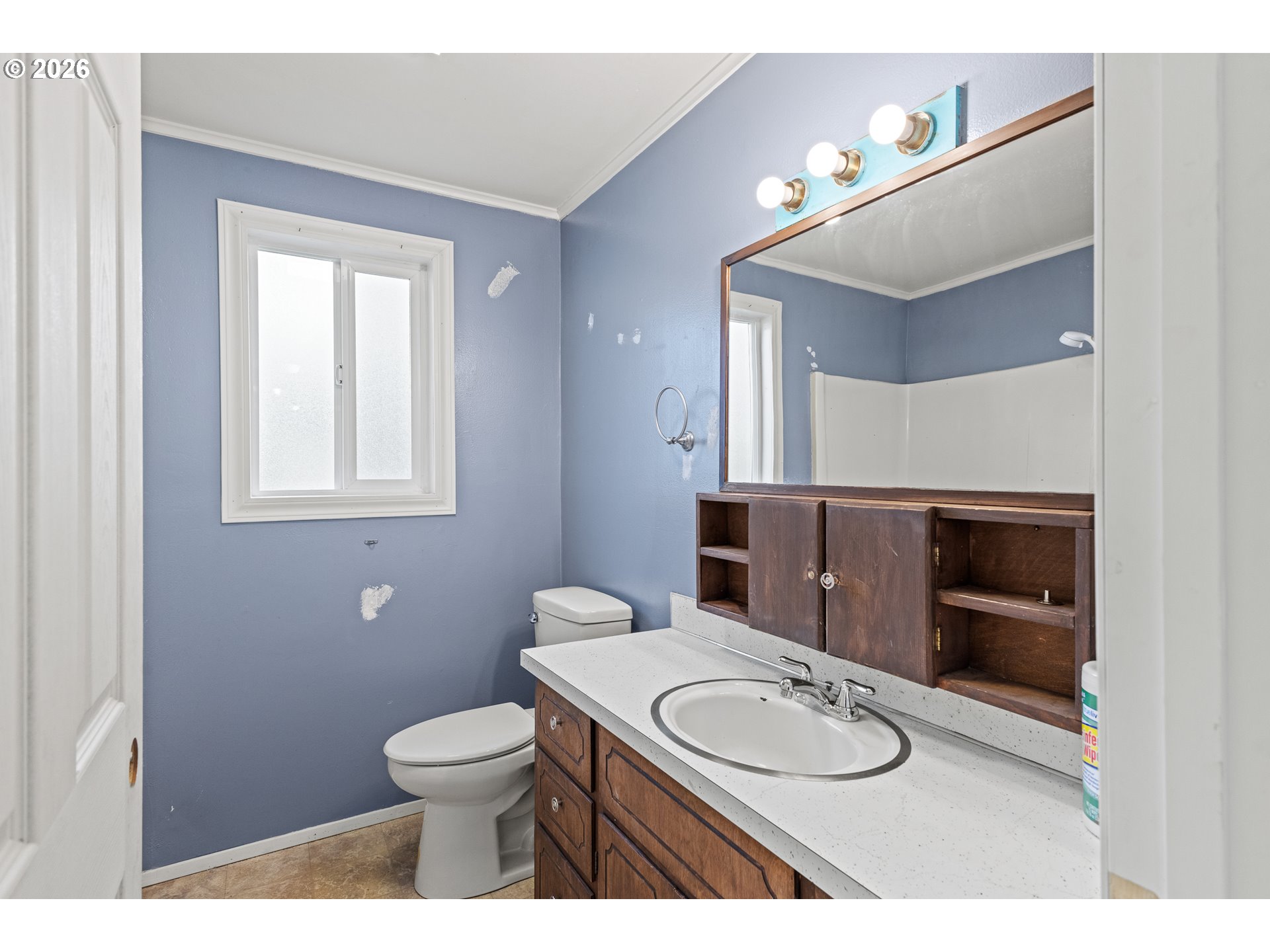 1816 Sunset Court Myrtle Point, OR 97458 - Photo 30 of 42 a bathroom with a toilet a sink and mirror