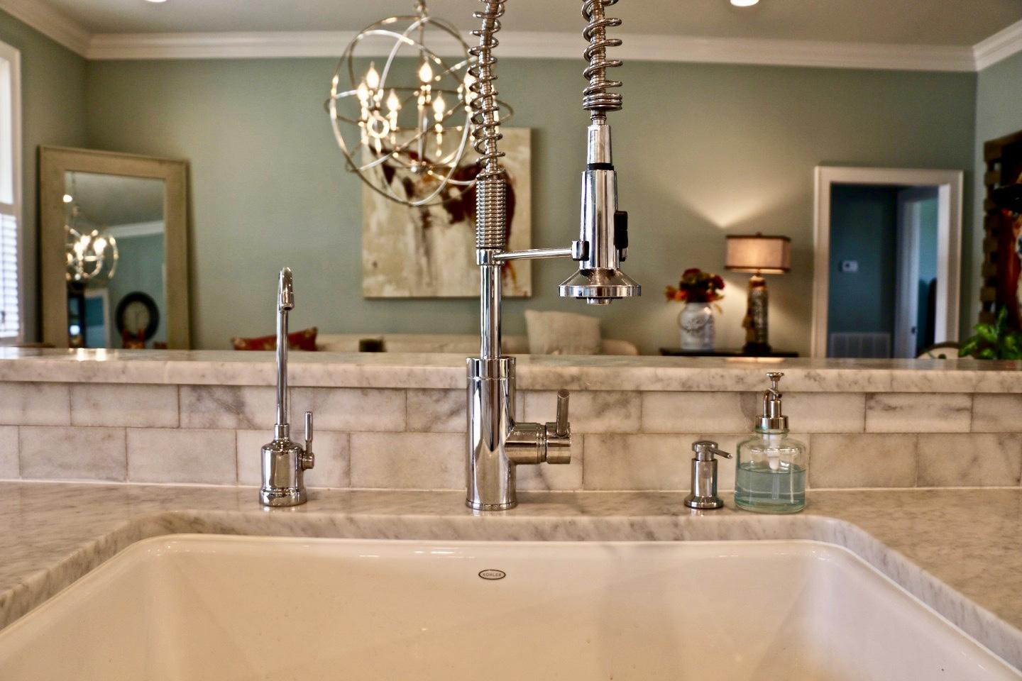 401 Youngs Road Vass, NC 28394 - Photo 11 of 33 You'll love the beautiful details in this kitchen! The carrara marble counters and subway tile backsplash are just some of the kitchen features.