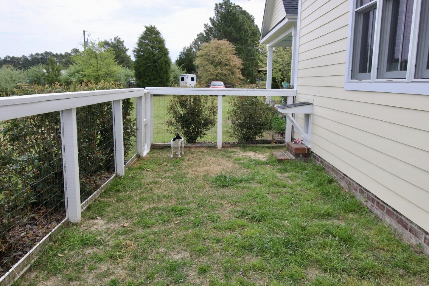 401 Youngs Road Vass, NC 28394 - Photo 29 of 33 This home is dog -ready! Feel secure leaving your dogs in this fenced-in run.