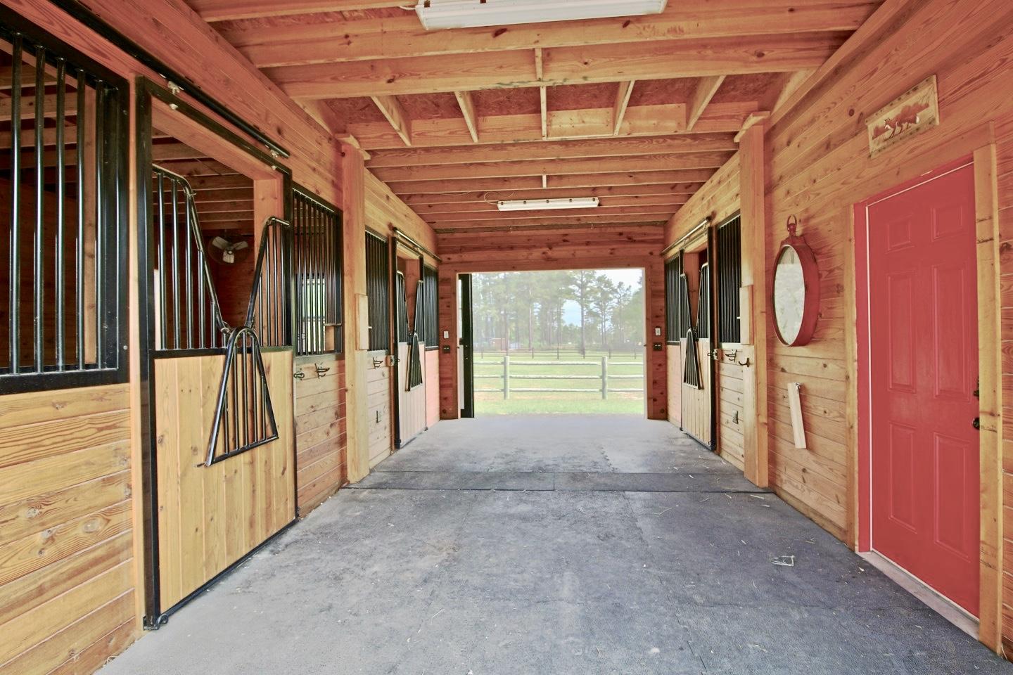 401 Youngs Road Vass, NC 28394 - Photo 31 of 33 The 3 stall barn with oversized stalls allows horses direct access to the pasture or to their own "mini" paddocks.