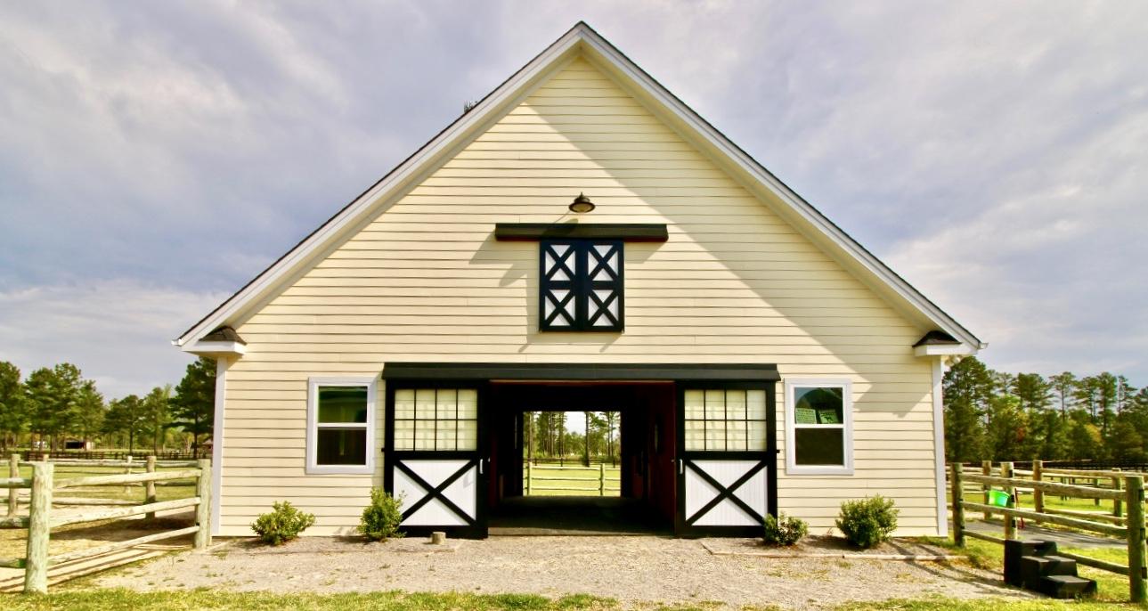 401 Youngs Road Vass, NC 28394 - Photo 32 of 33 The barn also features a tack room and half bath and plenty of hay loft storage. This space could easily be finished into an apartment.