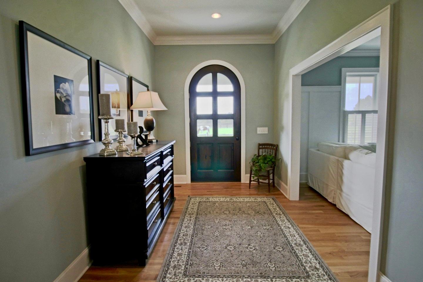 401 Youngs Road Vass, NC 28394 - Photo 4 of 33 This home features a beautiful entryway leading into the living room. Notice the white oak hardwood floors throughout.