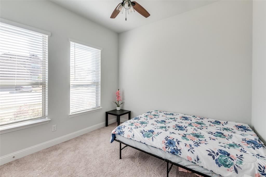 1216 Collett Sublett Road Kennedale, TX 76060 - Photo 12 of 25 a bedroom with a bed and a window