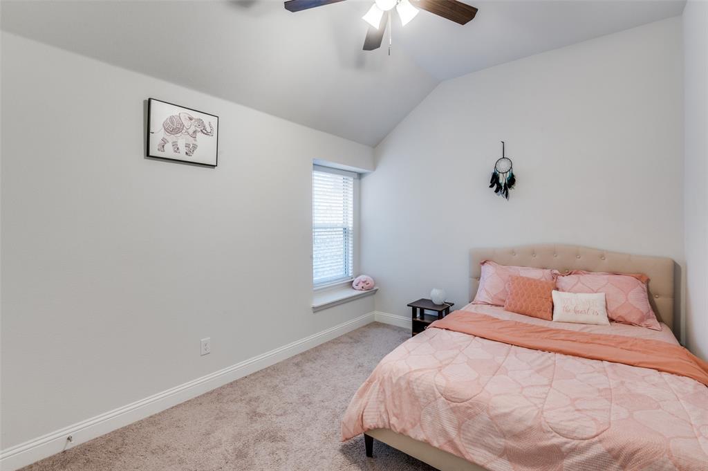 1216 Collett Sublett Road Kennedale, TX 76060 - Photo 14 of 25 a bedroom with a large bed and a window