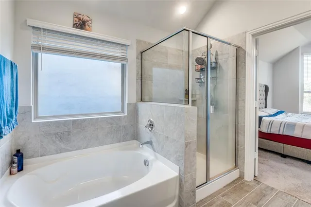 a bathroom with 2 sink tub and a mirror