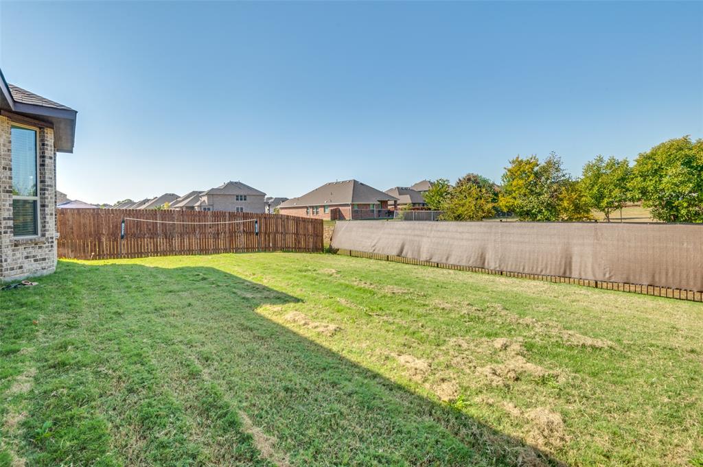 1216 Collett Sublett Road Kennedale, TX 76060 - Photo 24 of 25 a view of an house with backyard and garden