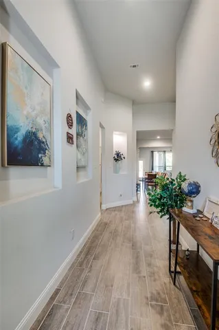 a view of an entryway with wooden floor