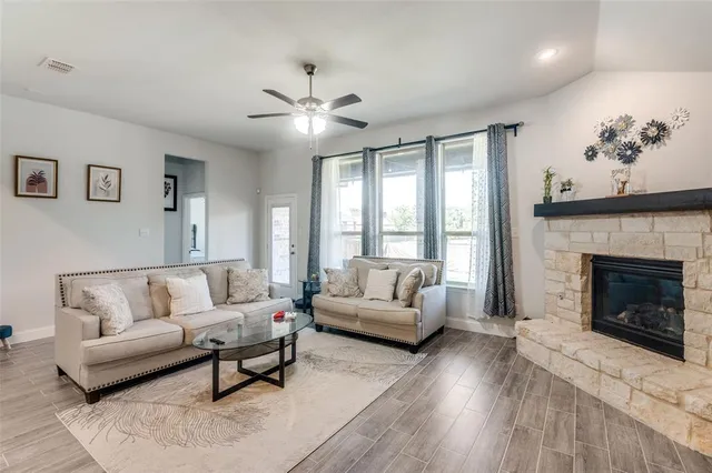 a living room with furniture and a fireplace