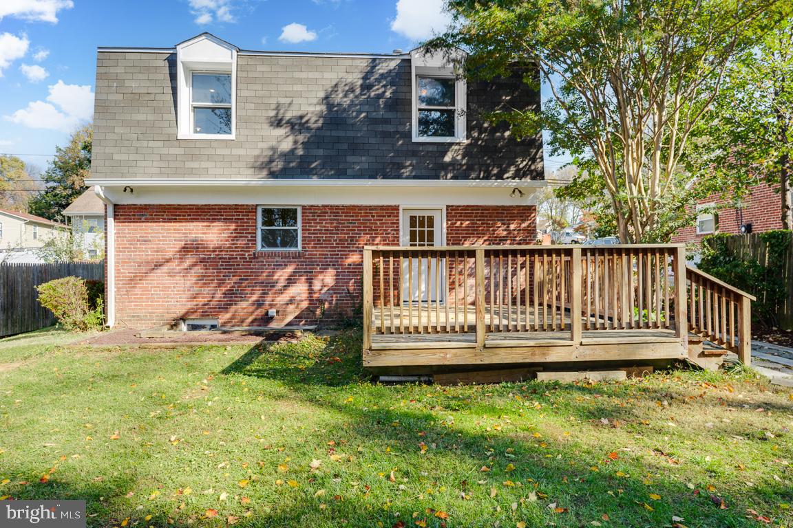 2504 Weisman Road Silver Spring, MD 20902 - Photo 21 of 30 a view of a house with a yard and deck
