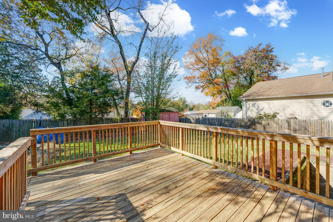 2504 Weisman Road Silver Spring, MD 20902 - Photo 23 of 30 a view of balcony with wooden floor and fence
