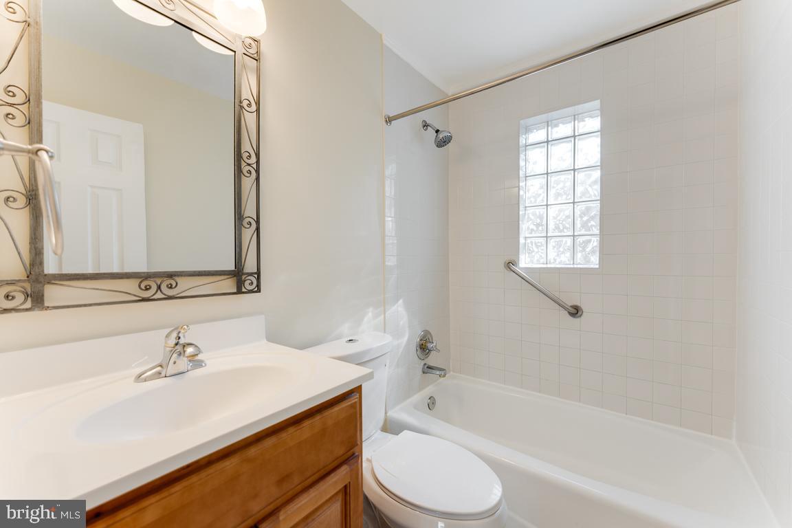 2504 Weisman Road Silver Spring, MD 20902 - Photo 10 of 30 a bathroom with a sink toilet tub and shower