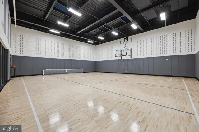a view of a kitchen with a refrigerator and a window