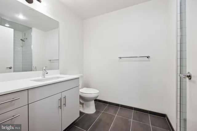 a bathroom with a sink toilet and vanity