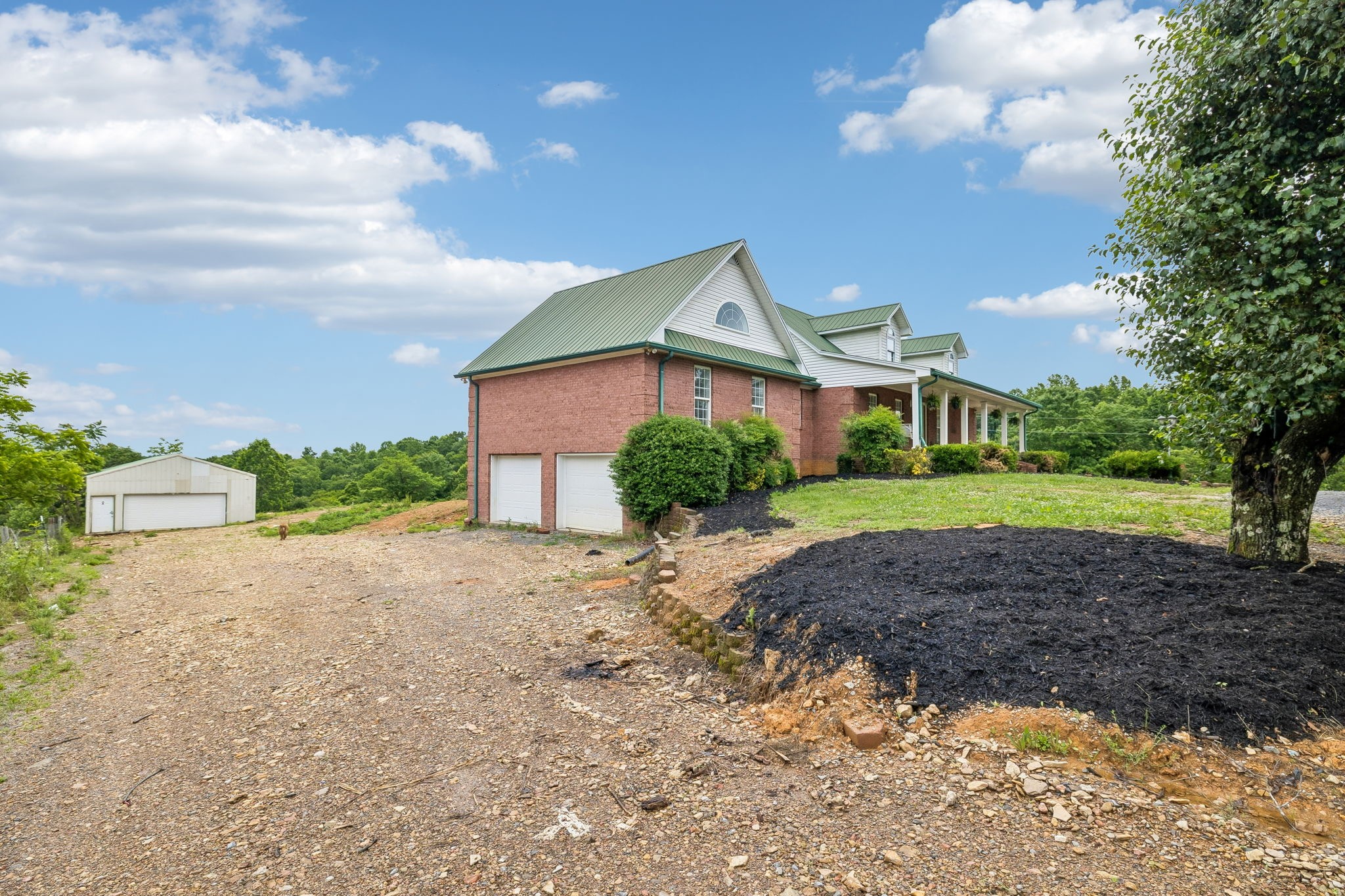 6701 McCormick Ridge Road Whitleyville, TN 38588 - Photo 7 of 63 a front view of a house with a garden