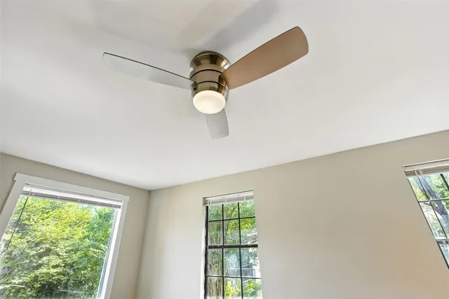 a view of room with windows and air conditioner
