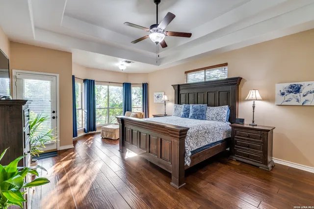 a living room with furniture wall and a flat screen tv