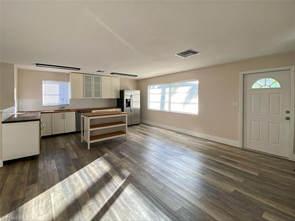 550 14th Street North Naples, FL 34102 - Photo 4 of 21 a view of a room with window and wooden floor