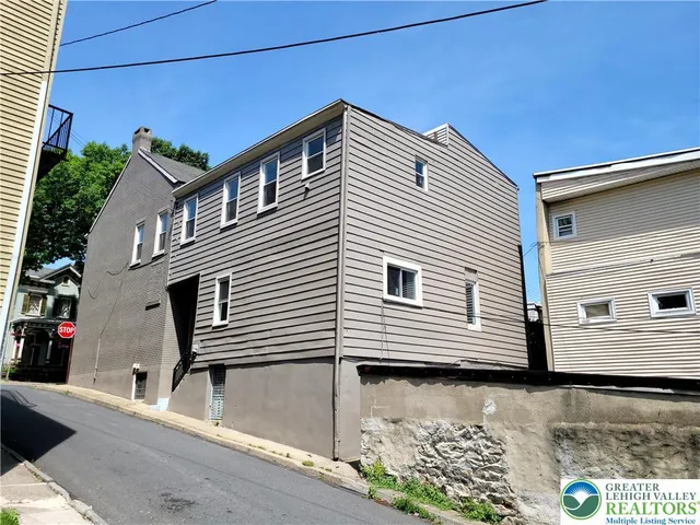 a view of a house with a street