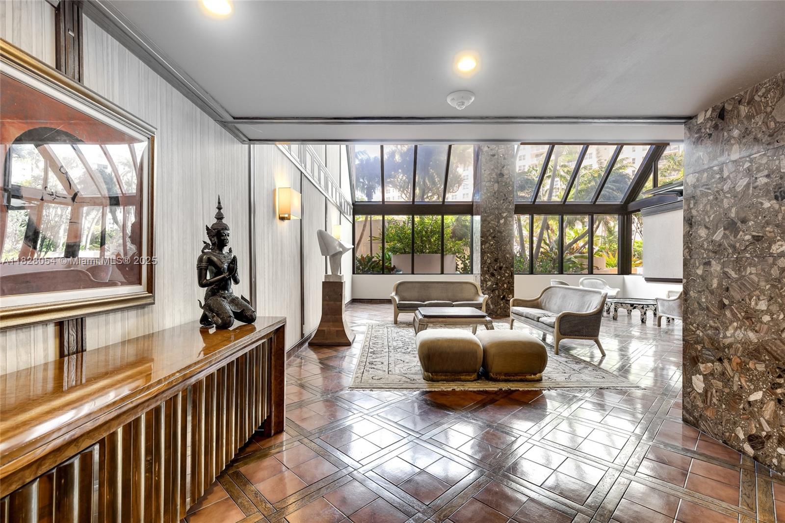 520 Brickell Key Drive, Unit A1817 Miami, FL 33131 - Photo 20 of 20 a living room with furniture and a large window