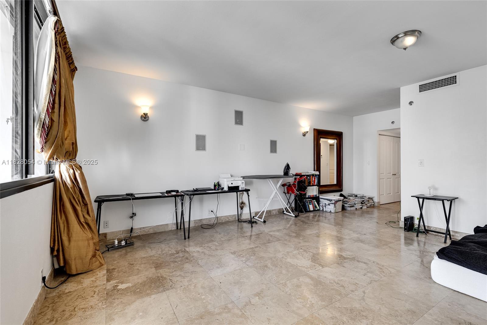 520 Brickell Key Drive, Unit A1817 Miami, FL 33131 - Photo 7 of 20 a view of a livingroom with furniture and a window